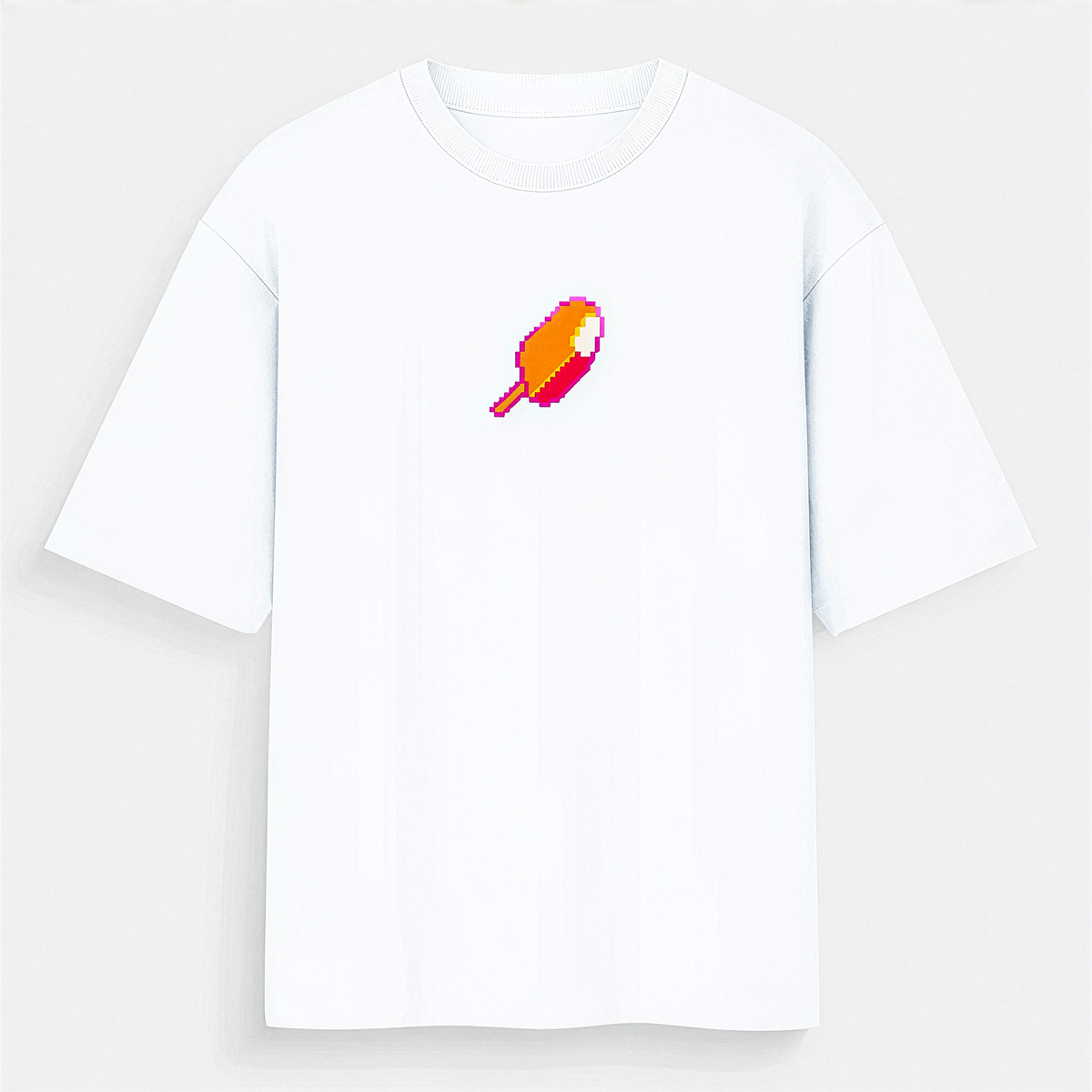 A white short-sleeve crewneck t-shirt with a small pixel-art style orange and pink graphic on the left chest, displayed against a light gray background.